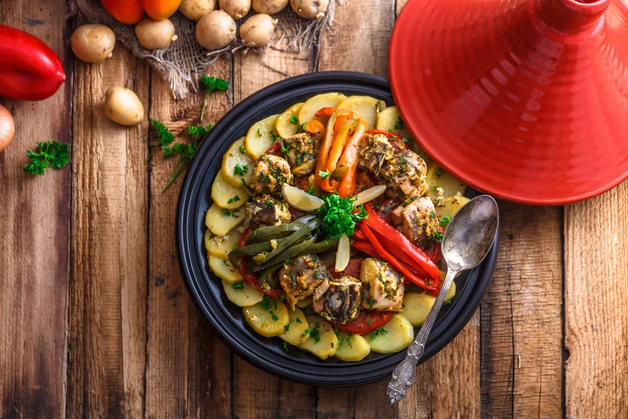 Fish tagine with chermoula, moroccan cuisine copy space